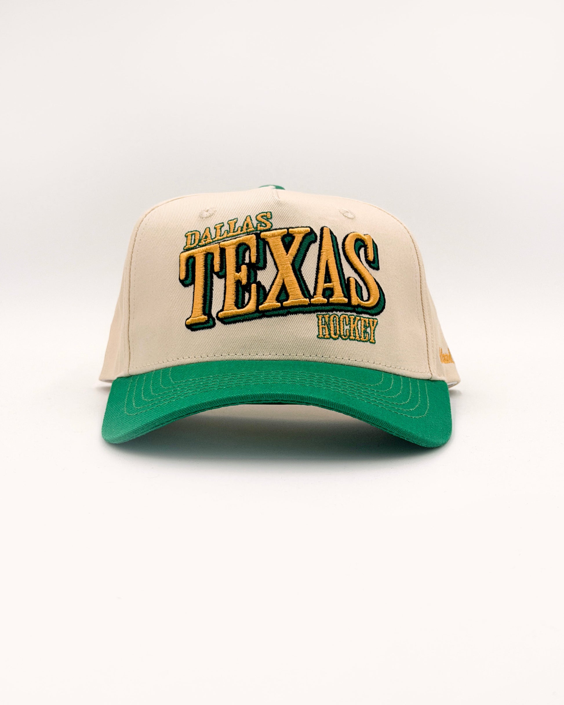 Outland Club Co. Dallas City Ice Classic Snapback Hat - cream crown with green brim and bold DALLAS TEXAS HOCKEY embroidery, Texas hockey vintage sportswear style